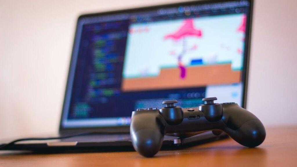 Representative gaming laptop and controller for Snapdragon X2 Elite handheld gaming coverage