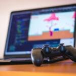 Representative gaming laptop and controller for Snapdragon X2 Elite handheld gaming coverage