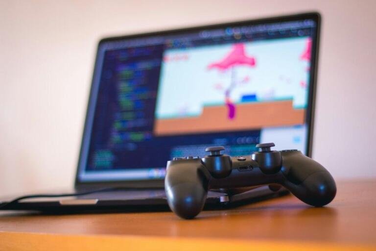 Representative gaming laptop and controller for Snapdragon X2 Elite handheld gaming coverage