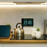 Digital screen in a modern home kitchen, illustrative image for an article about Apple's HomeView smart display, not a photo of HomeView