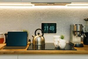 Digital screen in a modern home kitchen, illustrative image for an article about Apple's HomeView smart display, not a photo of HomeView