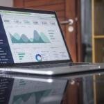 Marketing analytics laptop image for programmatic advertising business impact and ROI analysis